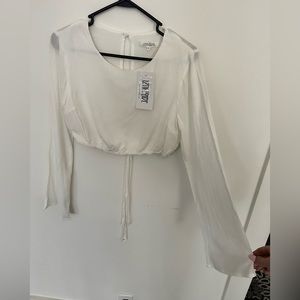 Cropped long sleeve white top